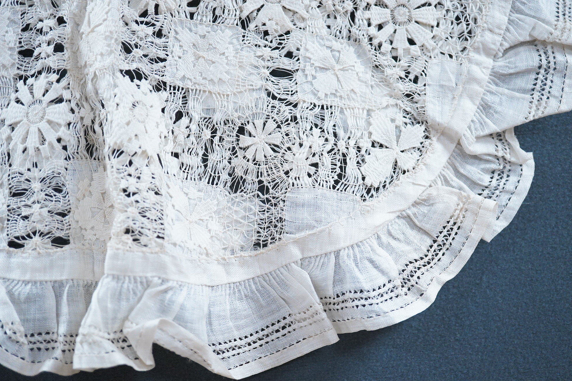 An ornate pineapple linen table cloth - 220cm x 190cm and a similar tea cosy, together with a collection of crochet edged, embroidered and cutwork table linens.